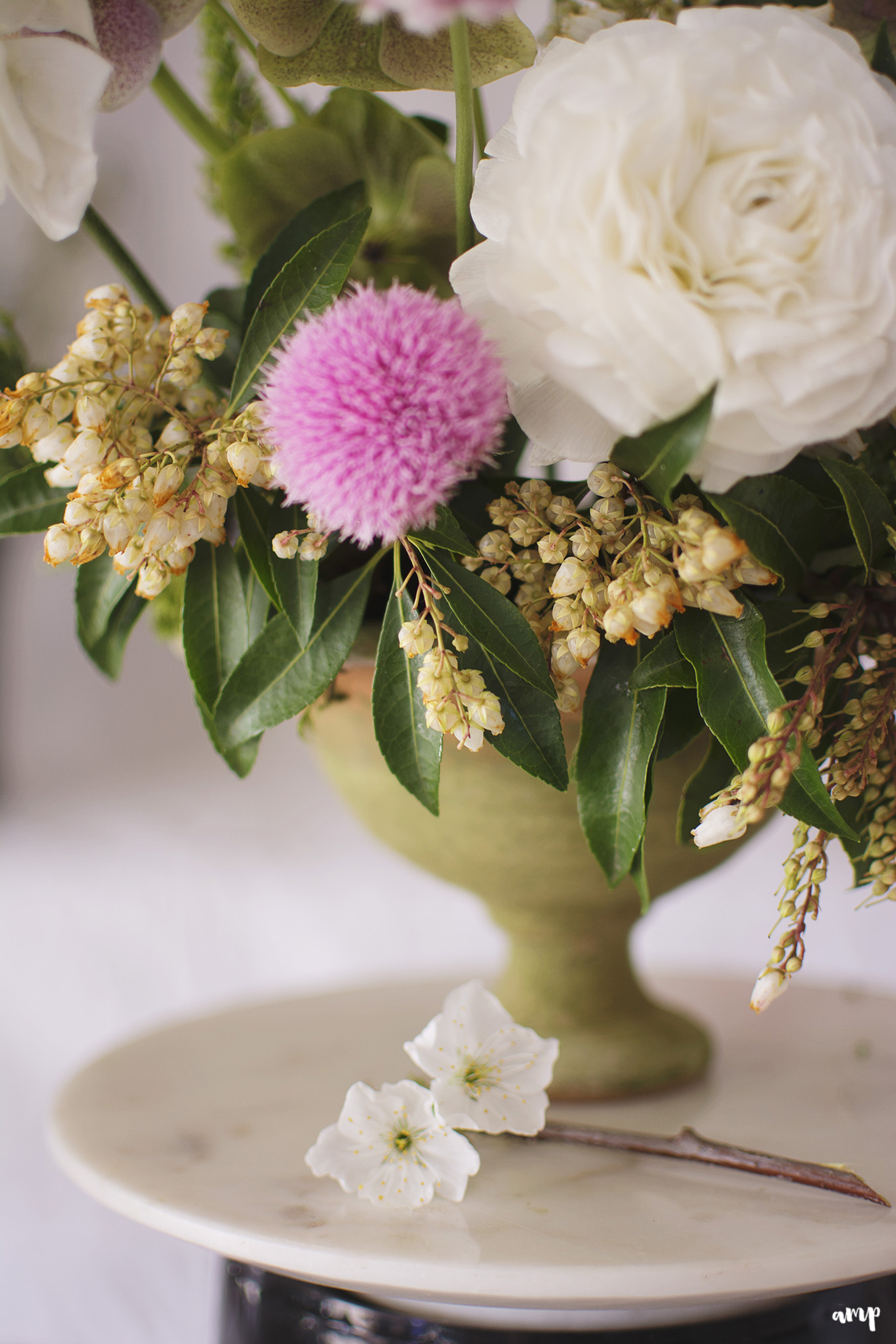 Close up of centerpiece with white and pink florals